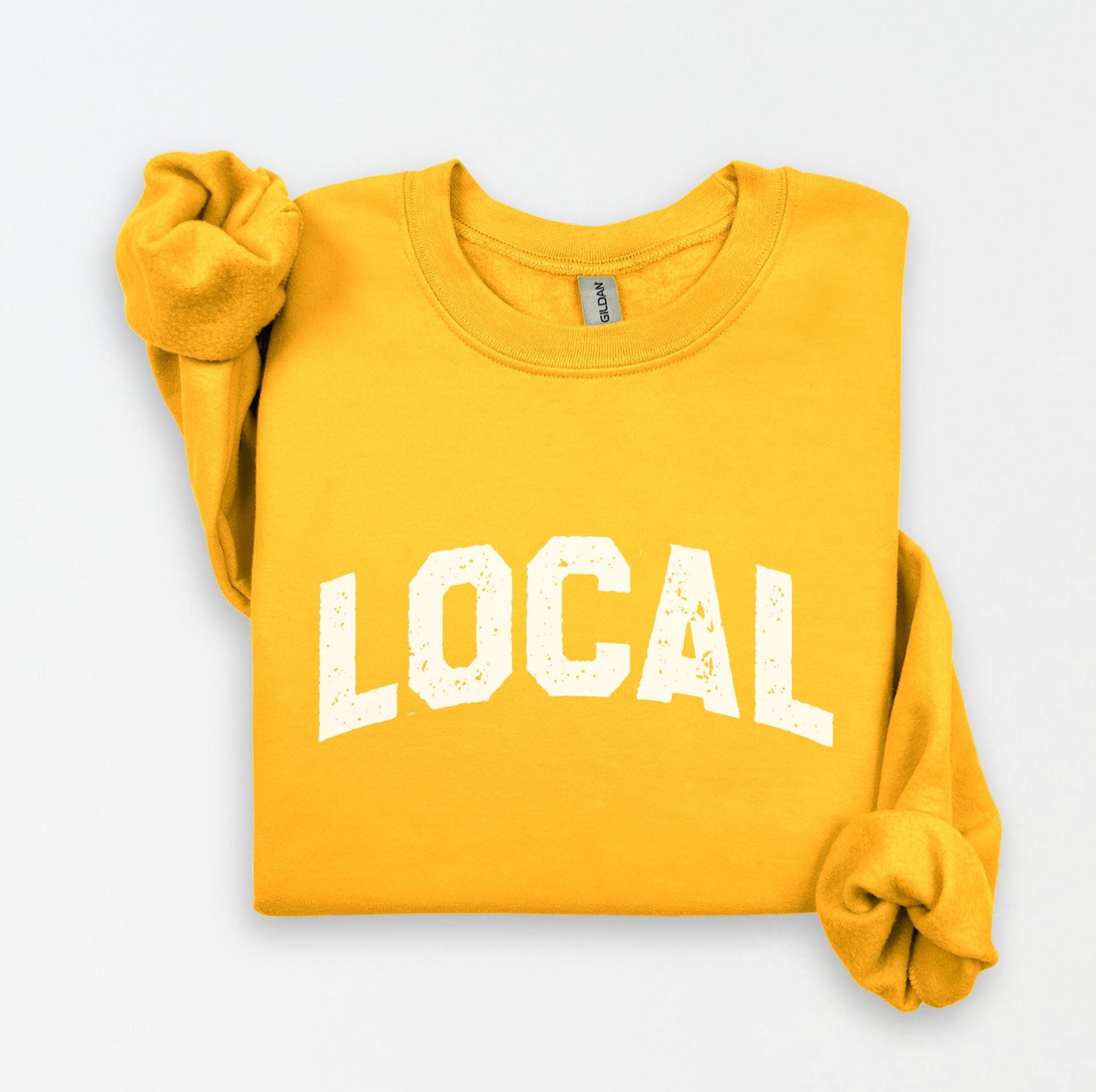 a yellow sweatshirt with the word local printed on it