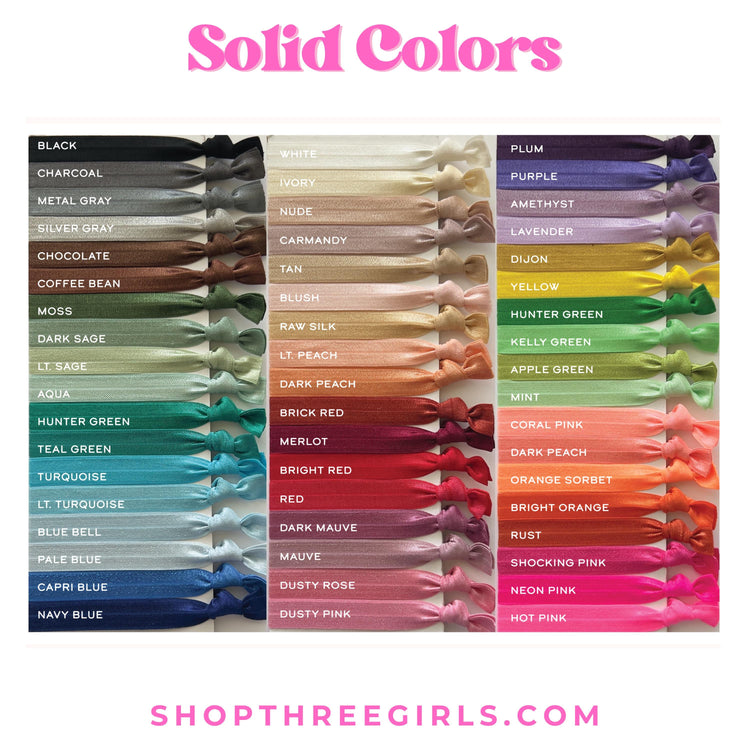 a collection of solid colors in various shades, including black, white, purple, and more, arranged in rows and columns.