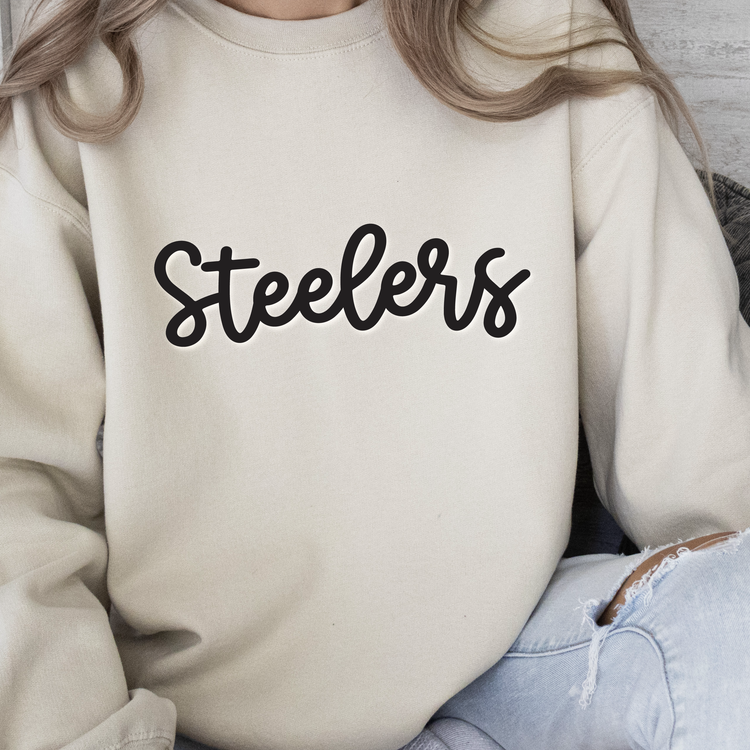 a woman wearing a sweatshirt with the word steelers on it